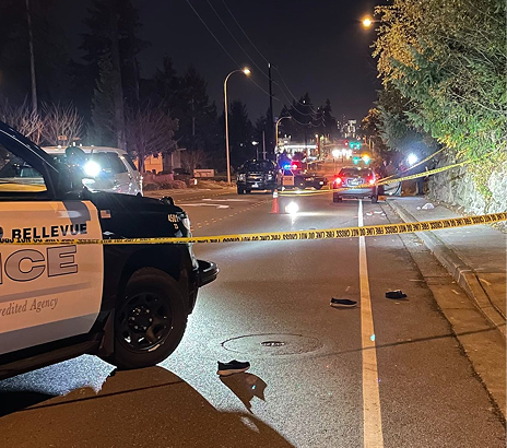 Aftermath of a car on pedestrian crash, shoes lying on the ground